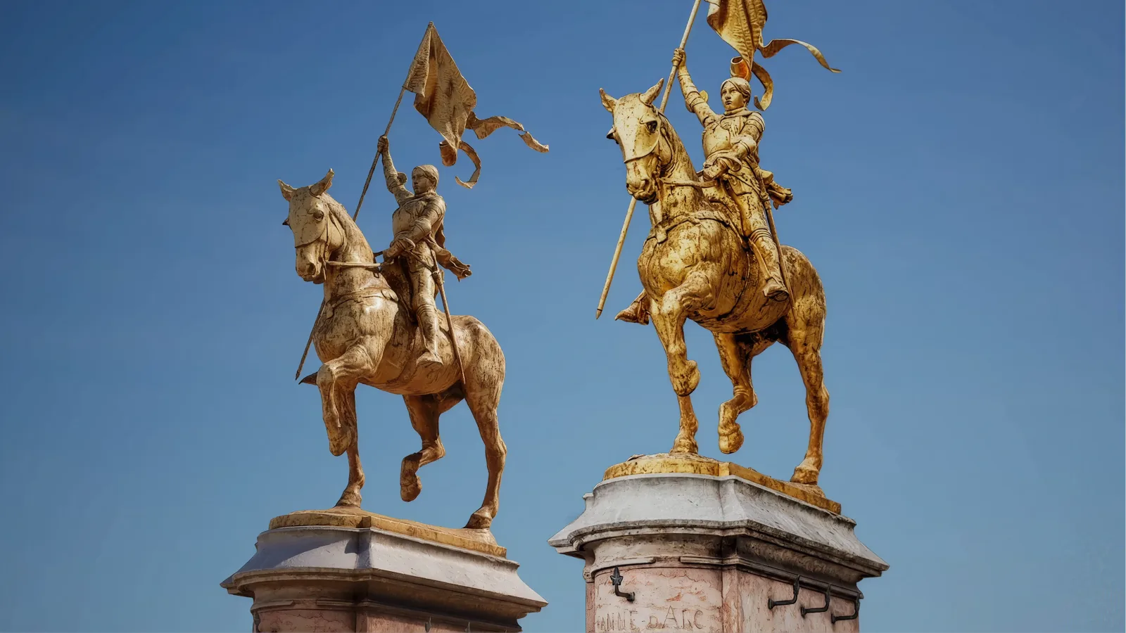 Gilded equestrian statues against a clear sky, captured as a photoreal 3D scene
