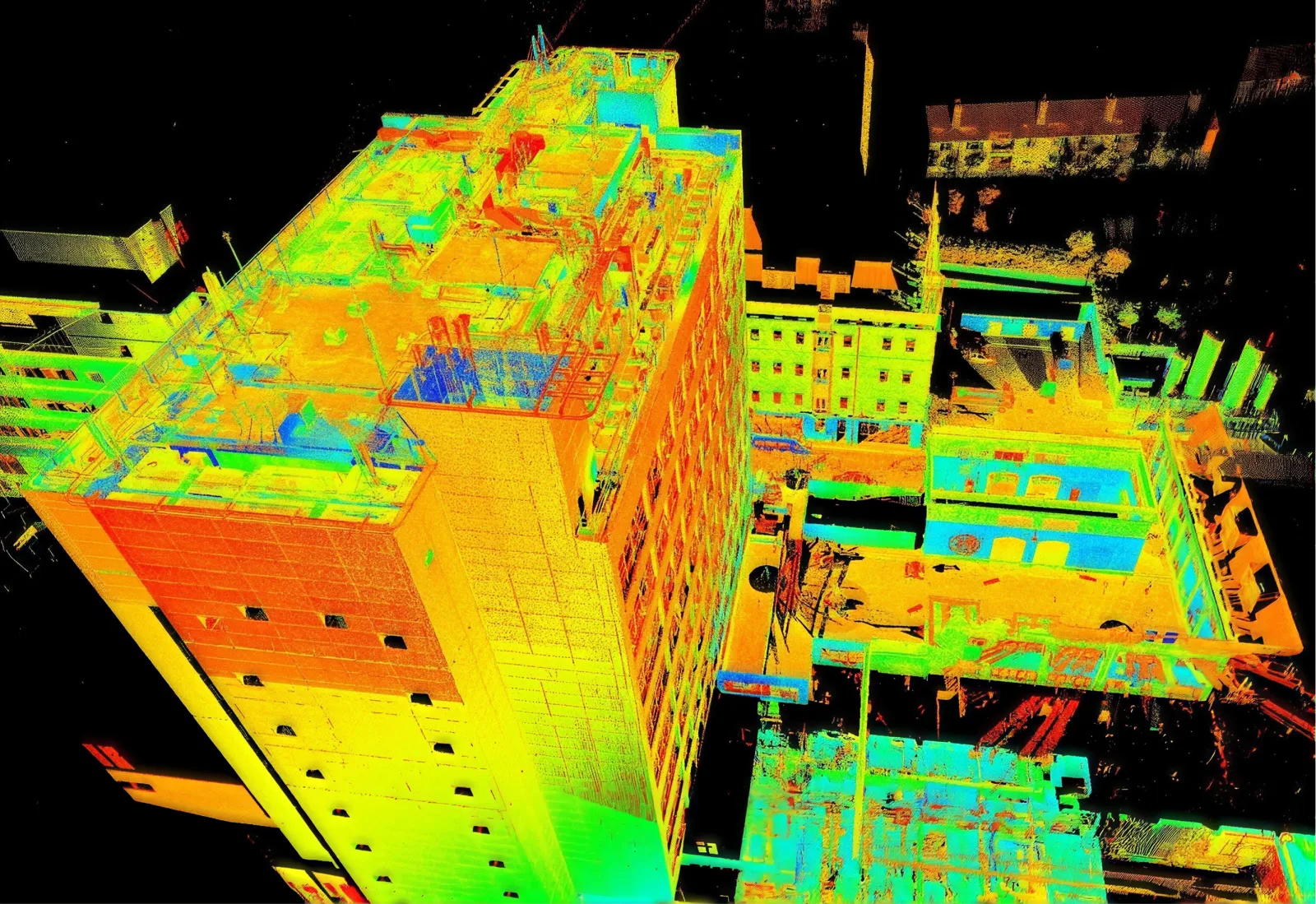 Colourised LiDAR point cloud of a building and neighbouring blocks seen from above