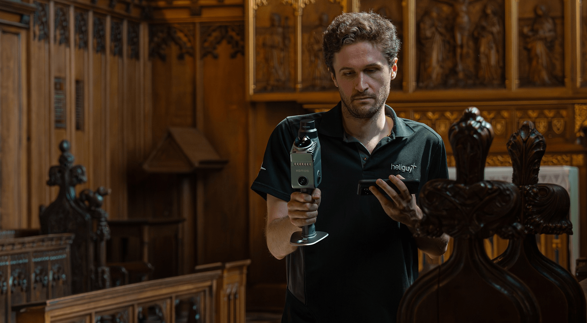 Operator 3D mapping a heritage interior with a handheld SLAM scanner