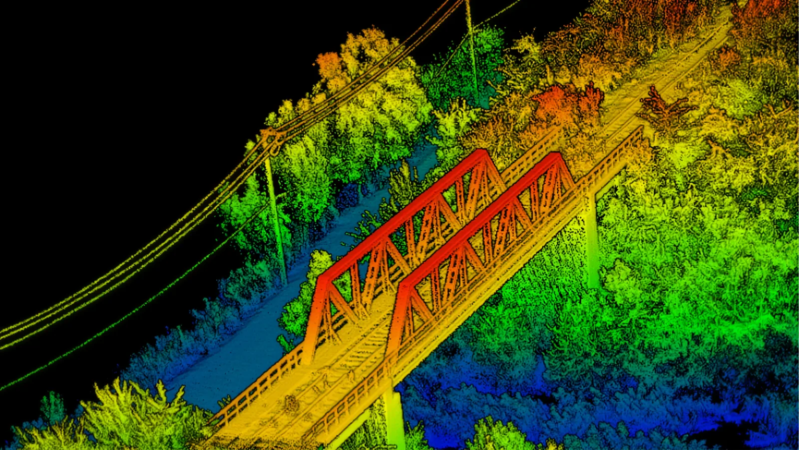 Colourised LiDAR point cloud of a truss bridge crossing a river